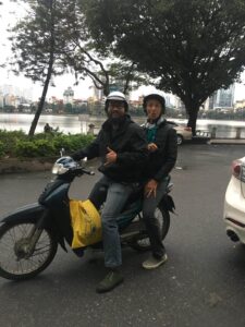 Beth on scooter ride in Hanoi, Vietnam