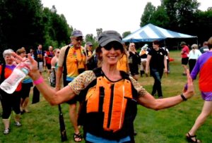 Younger Charlotte in life vest at a sports event