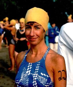 Younger Charlotte in bathing suit and cap