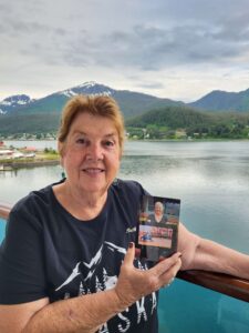 Ruth on Alaska cruise holding picture of Linda