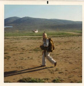 Sharry walking to the Bodacious Thunderchicken - a WWII war plane for her first parachute jump - 1972