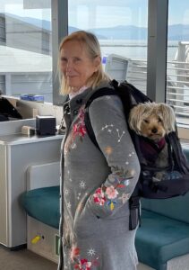 Sylvia carrying an 11-pound rucksack with Yorkie, Biscuit, inside